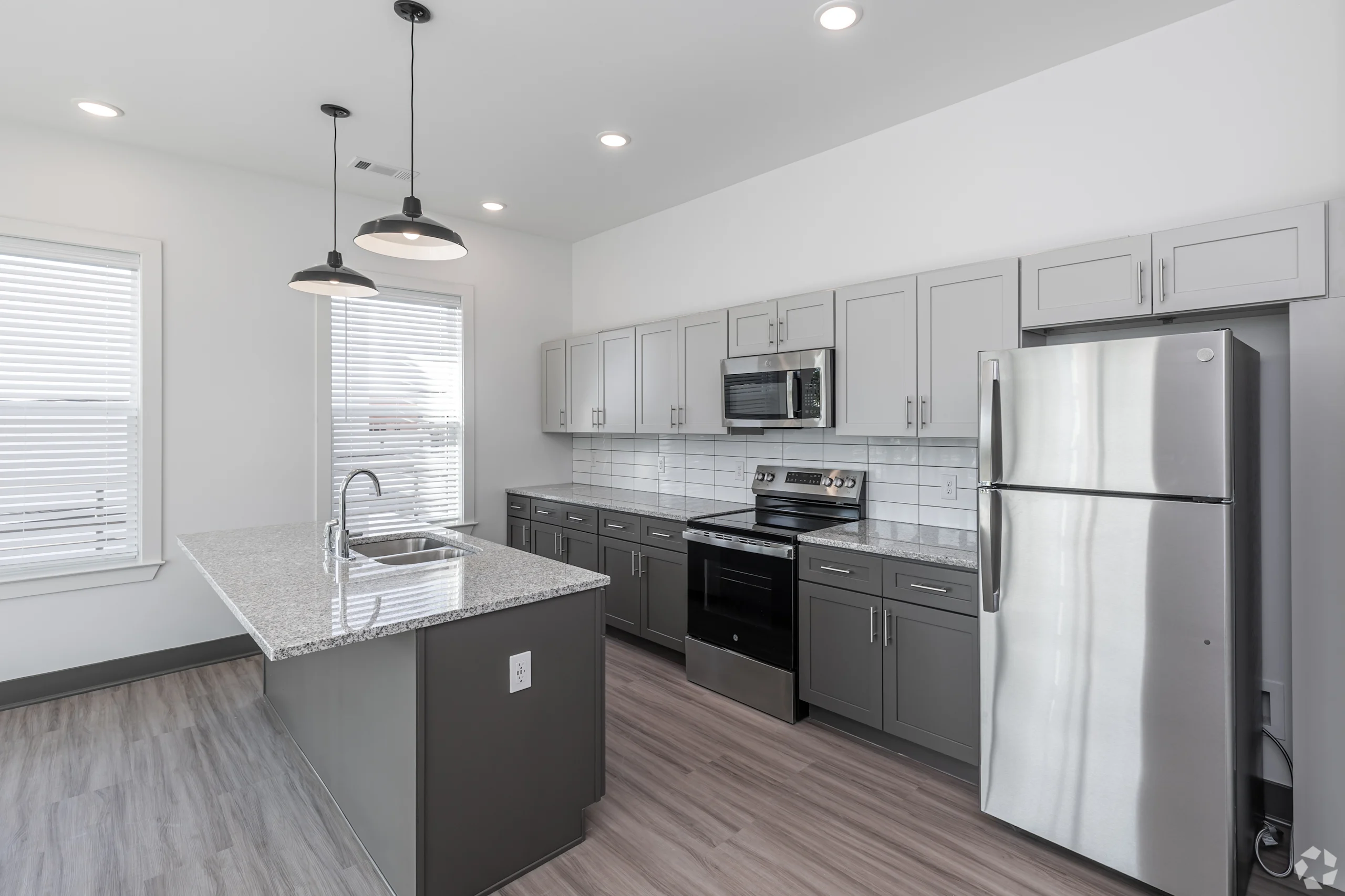 Modern kitchen with pendant lights and island